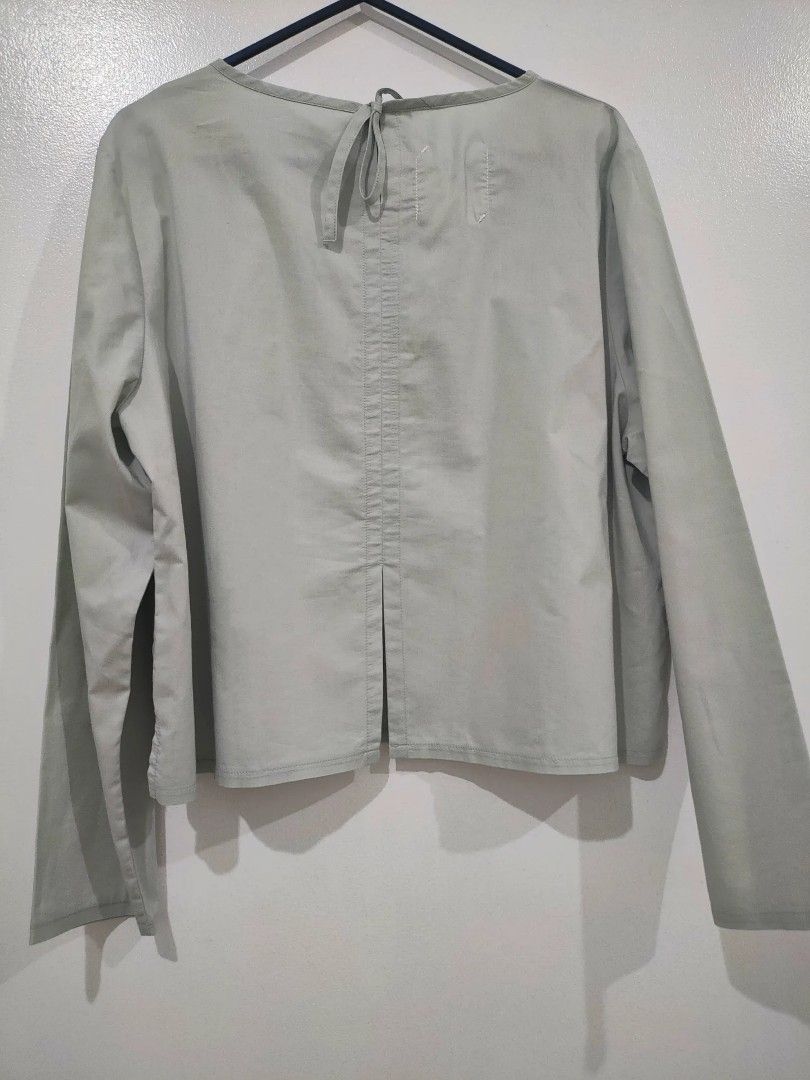 SIMPLY FROM Gray Long Sleeve Top with Back Tie (Category: Longsleeves) located in Quezon City. Submitted by maxsab (Listing ID 1463921691, Image 3). Description: - Light green long sleeve top - Brand: SIMPLY FROM - Features a tie-back detail at the neckline - Light and breathable fabric - Versatile for layering or wearing alone - Ideal for casual outings and relaxed days.