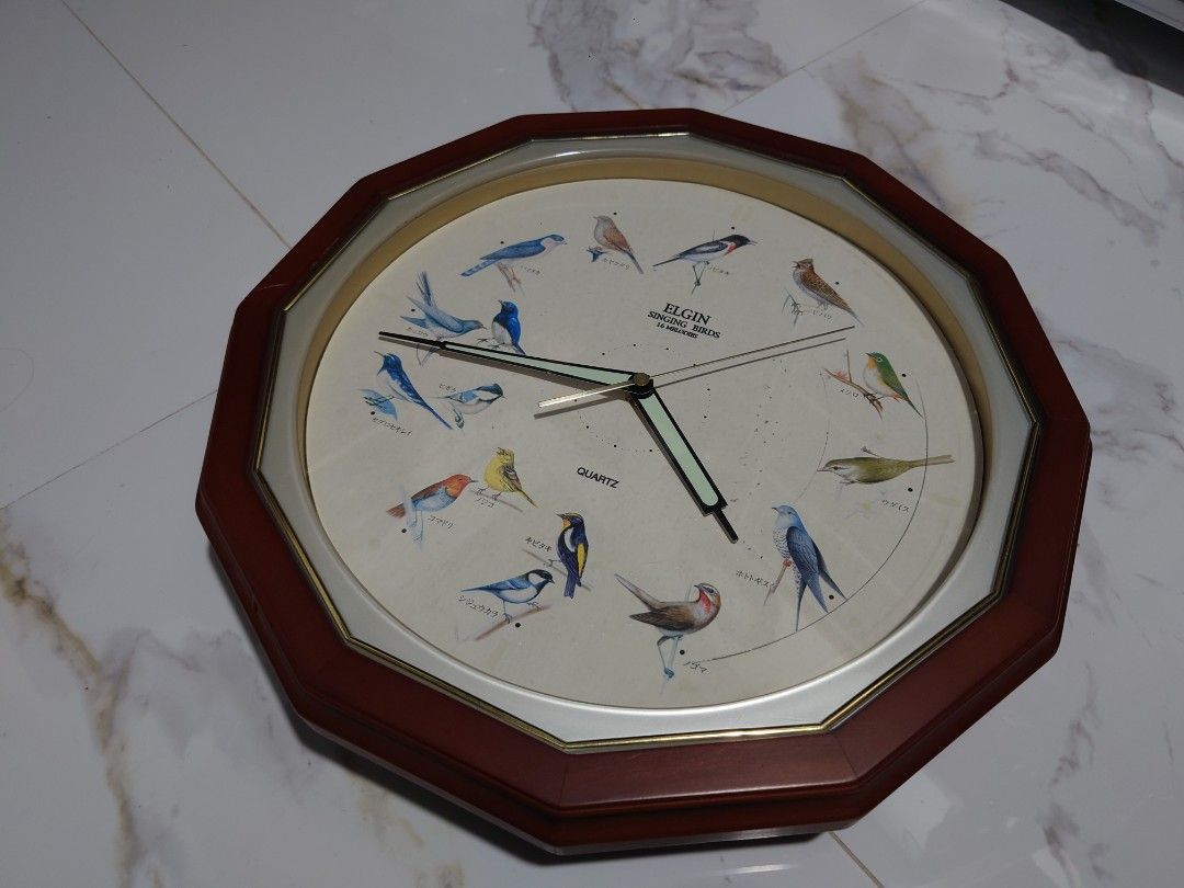 Singing Birds Clock (Category: Clocks) located in General Trias. Submitted by mervcorner (Listing ID 1463926915, Image 2). Description: Tweets every hour depending on the time and assigned bird reminding you that every hour is important. Brand: Elgin 12 Melodies Singing Birds Quartz Made in Japan Loud and Clear Sound Uses 2x Size C batteries (Included - Rechargable) and 1x AA (Included - Non Rechargable) Note: Minutero hand is malfuctioning when 