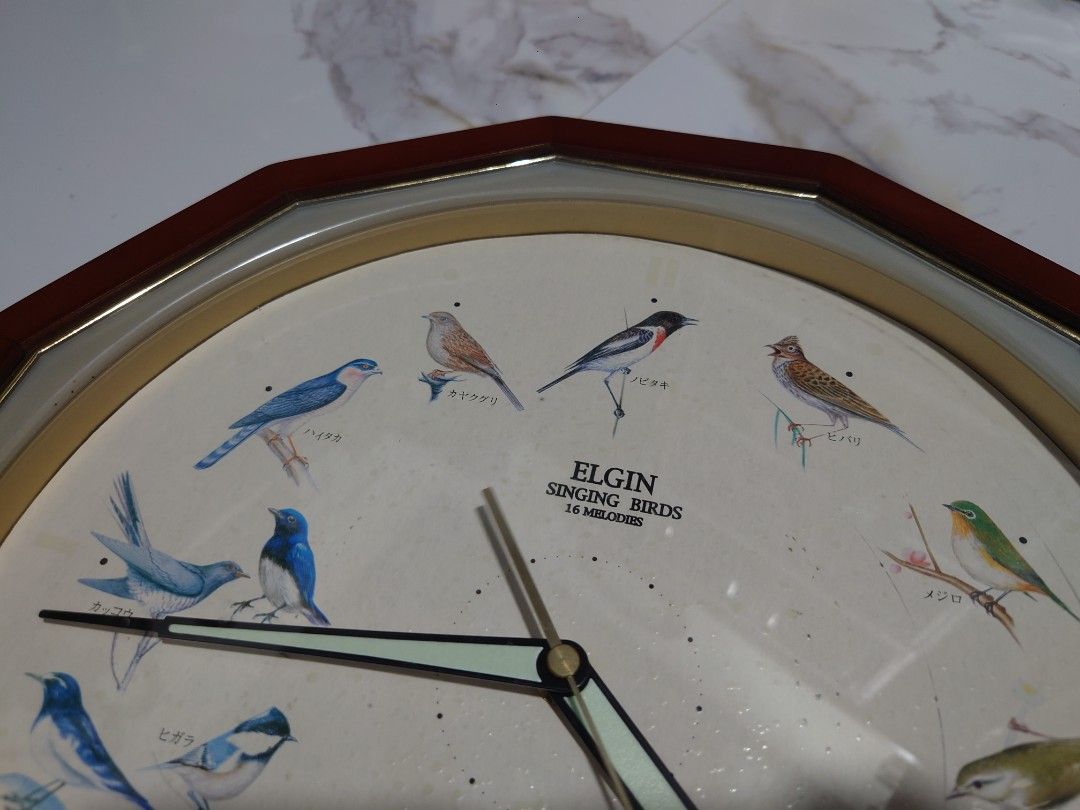 Singing Birds Clock (Category: Clocks) located in General Trias. Submitted by mervcorner (Listing ID 1463926915, Image 3). Description: Tweets every hour depending on the time and assigned bird reminding you that every hour is important. Brand: Elgin 12 Melodies Singing Birds Quartz Made in Japan Loud and Clear Sound Uses 2x Size C batteries (Included - Rechargable) and 1x AA (Included - Non Rechargable) Note: Minutero hand is malfuctioning when 