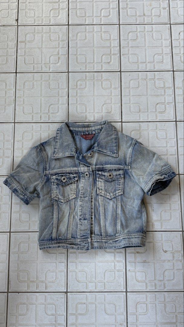 Sky Bomb Denim Shirt (Category: Coats, Jackets and Outerwear) located in Manila. Submitted by bubbles.dan (Listing ID 1463770603, Image 2). Description: - Classic blue denim shirt (short sleeve) - Washed-out look with distressed details - Button-up front - Chest pockets - Ideal for layering - Versatile wardrobe staple.