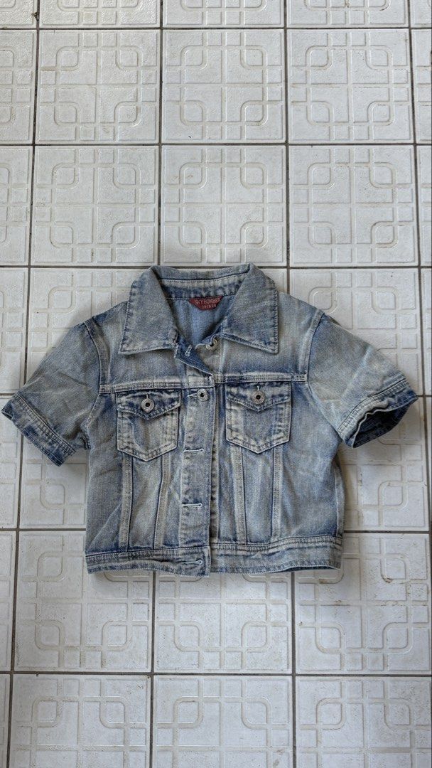 Sky Bomb Denim Shirt (Category: Coats, Jackets and Outerwear) located in Manila. Submitted by bubbles.dan (Listing ID 1463770603, Image 1). Description: - Classic blue denim shirt (short sleeve) - Washed-out look with distressed details - Button-up front - Chest pockets - Ideal for layering - Versatile wardrobe staple.