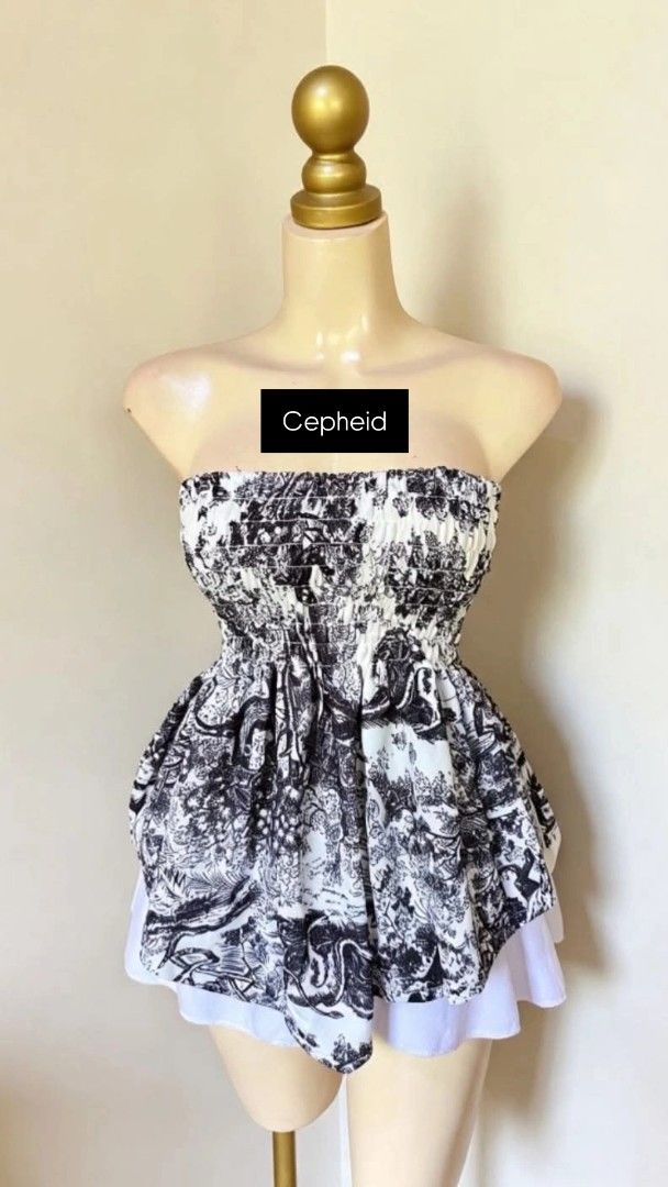 Smocked Black and White Pattern Tube Top (Category: Sleeveless) located in Agdangan. Submitted by cepheid_regaspi (Listing ID 1463861666, Image 1). Description: - Cute smocked tube top - Black and white toile-like pattern - Comfortable, stretchy smocked bust - Slightly flared hem - Versatile: pairs well with shorts or skirts - Ideal for casual outfits.