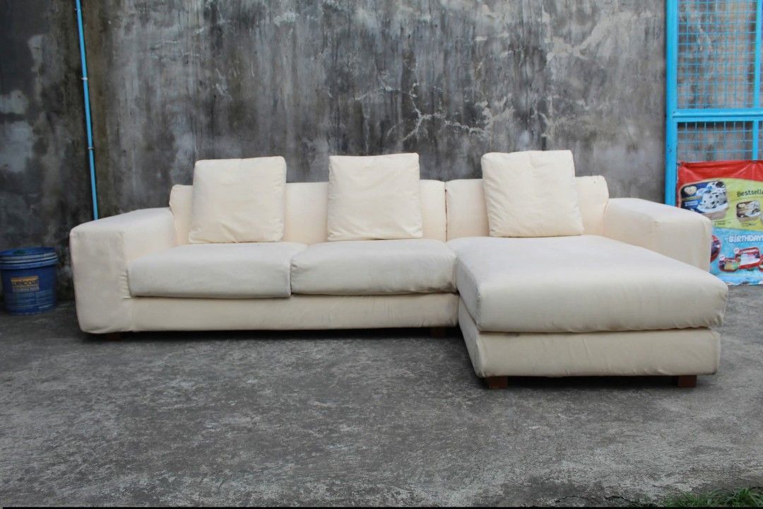 Sofa Set (Category: Sofas) located in Meycauayan. Submitted by marygracecasimiro (Listing ID 1463936854, Image 3). Description: NOYES L-Shaped Sofa with Chaise Premium NOYES SOFA 100% Japanese-made L-shaped sofa with a spacious chaise section and soft cream gamuza upholstery. Known for its quality craftsmanship and minimalist Japanese design, this sofa provides generous seating and a comfortable chaise for lounging. A great addition to modern liv