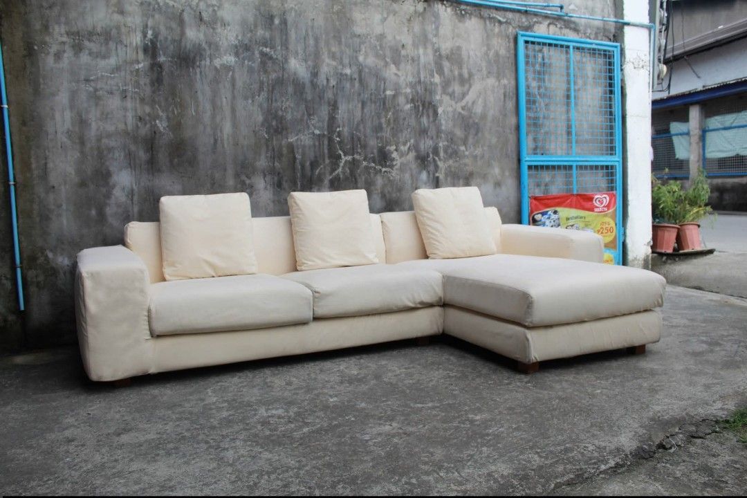 Sofa Set (Category: Sofas) located in Meycauayan. Submitted by marygracecasimiro (Listing ID 1463936854, Image 2). Description: NOYES L-Shaped Sofa with Chaise Premium NOYES SOFA 100% Japanese-made L-shaped sofa with a spacious chaise section and soft cream gamuza upholstery. Known for its quality craftsmanship and minimalist Japanese design, this sofa provides generous seating and a comfortable chaise for lounging. A great addition to modern liv