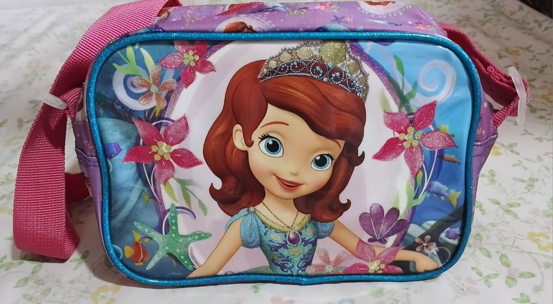 Sofia the First Kids Shoulder Bag (Category: Babies & Kids Fashion) located in Quezon City. Submitted by bagotluma (Listing ID 1463746100, Image 2). Description: Sofia the First shoulder bag for kids Features a vibrant Sofia print Adjustable strap with buckle for a comfortable fit Secure zipper closure to keep belongings safe Bright pink interior lining Ideal for carrying small toys, snacks, or other essentials *item in good condition *no return 