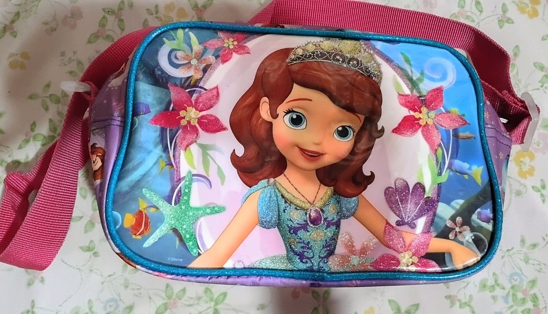 Sofia the First Kids Shoulder Bag (Category: Babies & Kids Fashion) located in Quezon City. Submitted by bagotluma (Listing ID 1463746100, Image 3). Description: Sofia the First shoulder bag for kids Features a vibrant Sofia print Adjustable strap with buckle for a comfortable fit Secure zipper closure to keep belongings safe Bright pink interior lining Ideal for carrying small toys, snacks, or other essentials *item in good condition *no return 