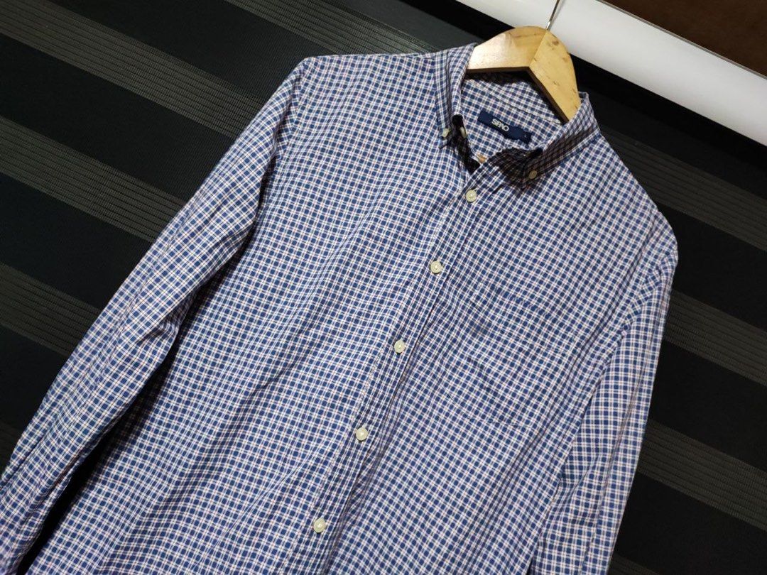 Spao Long Sleeve Button Down Plaid Polo Shirt (Category: Formal Shirts) located in Pasig City. Submitted by abogadosupremo (Listing ID 1463839363, Image 2). Description: Spao Checkered Long Sleeve Polo -Spao long-sleeved shirt features a classic checkered pattern in blue and white. -It has a button-down collar and a single chest pocket. -It's a versatile piece suitable for various occasions. - Very Good Condition - No issue / Legit - Size : Large