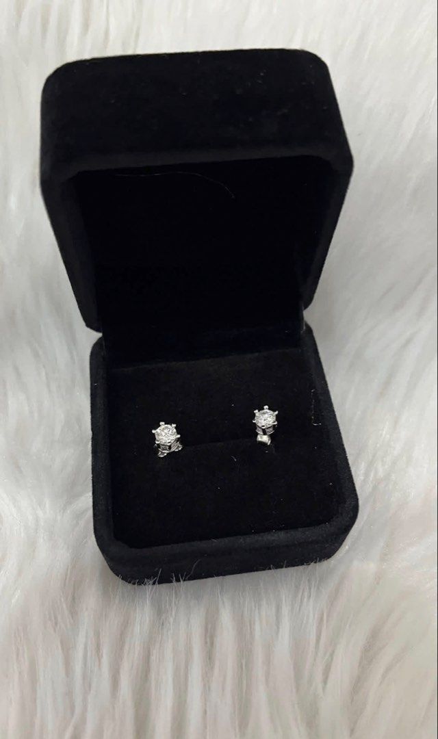 Sparkling Stud Earrings in Black Velvet Box (Category: Earrings) located in Manila. Submitted by missyoung222 (Listing ID 1463800715, Image 1). Description: -Moisannite Silver Stud Earrings .03ct (total .06 ct) -with Certificate - Elegant stud earrings with a subtle, noticeable sparkle. - Classic four-prong setting for a timeless look. - Versatile: Ideal for everyday wear or special occasions. - Presented in a luxurious black velvet jewelry box. 