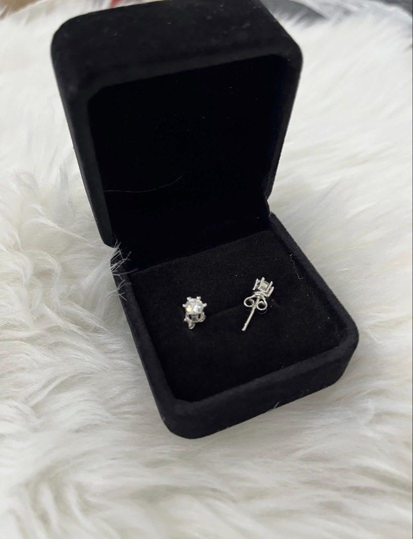 Sparkling Stud Earrings in Black Velvet Box (Category: Earrings) located in Manila. Submitted by missyoung222 (Listing ID 1463800715, Image 3). Description: -Moisannite Silver Stud Earrings .03ct (total .06 ct) -with Certificate - Elegant stud earrings with a subtle, noticeable sparkle. - Classic four-prong setting for a timeless look. - Versatile: Ideal for everyday wear or special occasions. - Presented in a luxurious black velvet jewelry box. 