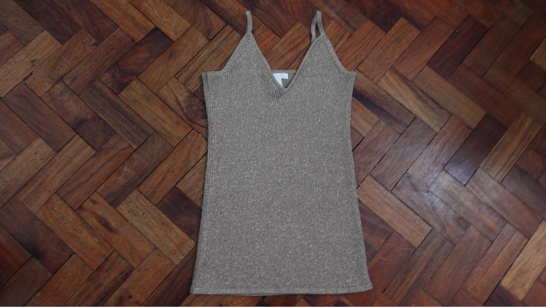 Sparkly Cami Top with V-Neck (Category: Sleeveless) located in Manila. Submitted by itsarah (Listing ID 1463851422, Image 1). Description: - Sparkly cami top - V-neckline - Thin straps - Subtle shimmer fabric - Versatile: dress up or down - Great for layering or wearing solo - Pairs well with jeans or skirts.