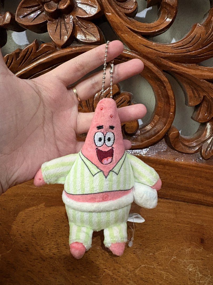 SpongeBob SquarePants Patrick Star Pajamas Plush Keychain (Category: Plushies & Soft Toys) located in Quezon City. Submitted by rxyel (Listing ID 1463804711, Image 2). Description: - Adorable Patrick Star plush toy - Wearing cute pajamas - Features a keychain attachment - Ideal for Spongebob Squarepants fans - Perfect for decorating bags or keys - Brand new with tag still attached.