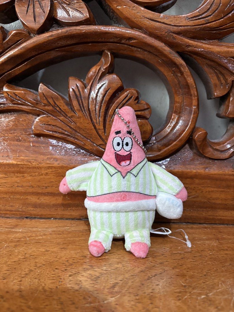 SpongeBob SquarePants Patrick Star Pajamas Plush Keychain (Category: Plushies & Soft Toys) located in Quezon City. Submitted by rxyel (Listing ID 1463804711, Image 1). Description: - Adorable Patrick Star plush toy - Wearing cute pajamas - Features a keychain attachment - Ideal for Spongebob Squarepants fans - Perfect for decorating bags or keys - Brand new with tag still attached.