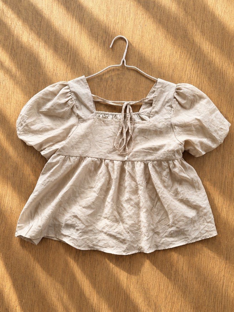 Square Neck Puff Sleeve Babydoll Top (Category: Blouses) located in Muntinlupa City. Submitted by cocofinds023 (Listing ID 1463778471, Image 1). Description: - Cute square neck top - Puff sleeves - Adjustable back tie for a perfect fit - Subtle textured fabric - Easy to dress up or down - Pairs well with jeans or skirts.