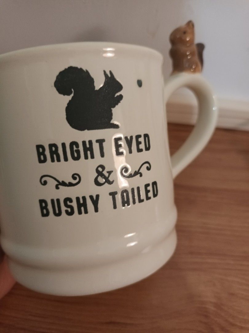 Squirrel Mug (Category: Coffee & Tea Tableware) located in Cavite. Submitted by fundamentally (Listing ID 1463905906, Image 3). Description: Cream-colored mug with a small squirrel sitting on the handle .
