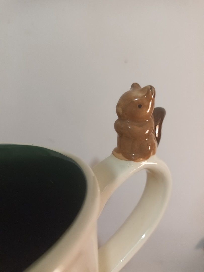 Squirrel Mug (Category: Coffee & Tea Tableware) located in Cavite. Submitted by fundamentally (Listing ID 1463905906, Image 2). Description: Cream-colored mug with a small squirrel sitting on the handle .