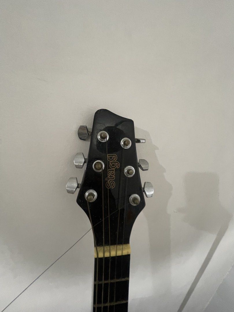 Stagg Deadnought Acoustic Guitar - Black (Category: Musical Instruments) located in Quezon City. Submitted by batto_sai (Listing ID 1463743156, Image 2). Description: - Issue: broken 6 string. Will replace if ever I get to the mall - Ideal for: Beginners or casual playing - Condition: Good, with minor scuffs on the body, not noticeable - no bag included Di nagagamit. Sayang lang. But in perfect condition.