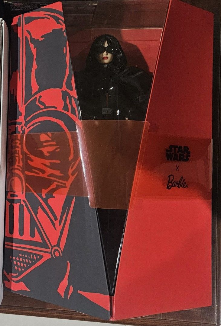 Star Wars x Barbie Darth Vader Doll (Category: Figurines & Statues) located in Las Pinas. Submitted by jenobon (Listing ID 1463832366, Image 1). Description: - Star Wars x Barbie Collaboration: Darth Vader doll - Brand New: Still in original, unopened packaging - Striking Packaging: Features red and black design with Darth Vader graphics - Iconic Logos: Showcases both Star Wars and Barbie branding - Unique Collectible: Perfect for fans of both fr
