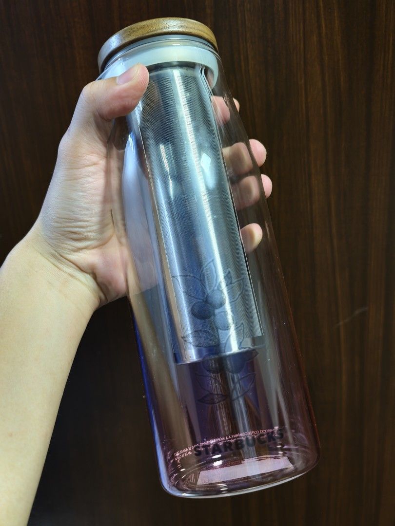 Starbucks Glass Cold Brew Coffee Tea Maker with Infuser (Category: Water Bottles & Tumblers) located in Taytay. Submitted by renz52 (Listing ID 1463836401, Image 3). Description: - Starbucks Glass Cold Brew Maker - Includes Stainless Steel Infuser - Elegant Wooden Lid - Subtle Pink Gradient Glass - Etched Coffee Plant Design - Ideal for Iced Coffee & Tea - Simple to Use and Clean New and unused condition Only 1 piece available Selling for Php 150