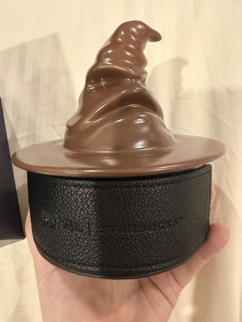 Starbucks Harry Potter Sorting Hat Coaster Set (Category: Coffee & Tea Tableware) located in Paranaque City. Submitted by mrschuadeclutter (Listing ID 1463787646, Image 3). Description: - Starbucks Harry Potter Coaster Set - Features iconic Sorting Hat design - Includes 4 coasters, one for each Hogwarts house: Gryffindor, Hufflepuff, Ravenclaw, and Slytherin - Comes in a beautiful presentation box - Ideal gift for any Harry Potter enthusiast or c