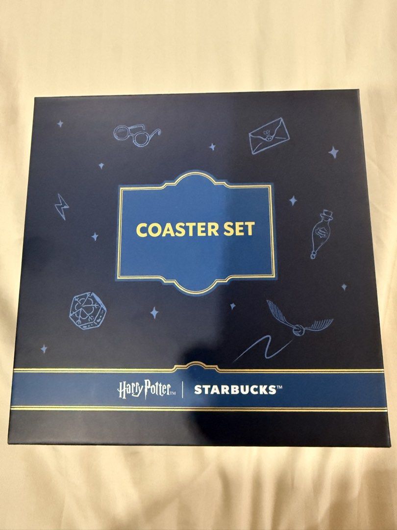 Starbucks Harry Potter Sorting Hat Coaster Set (Category: Coffee & Tea Tableware) located in Paranaque City. Submitted by mrschuadeclutter (Listing ID 1463787646, Image 1). Description: - Starbucks Harry Potter Coaster Set - Features iconic Sorting Hat design - Includes 4 coasters, one for each Hogwarts house: Gryffindor, Hufflepuff, Ravenclaw, and Slytherin - Comes in a beautiful presentation box - Ideal gift for any Harry Potter enthusiast or c