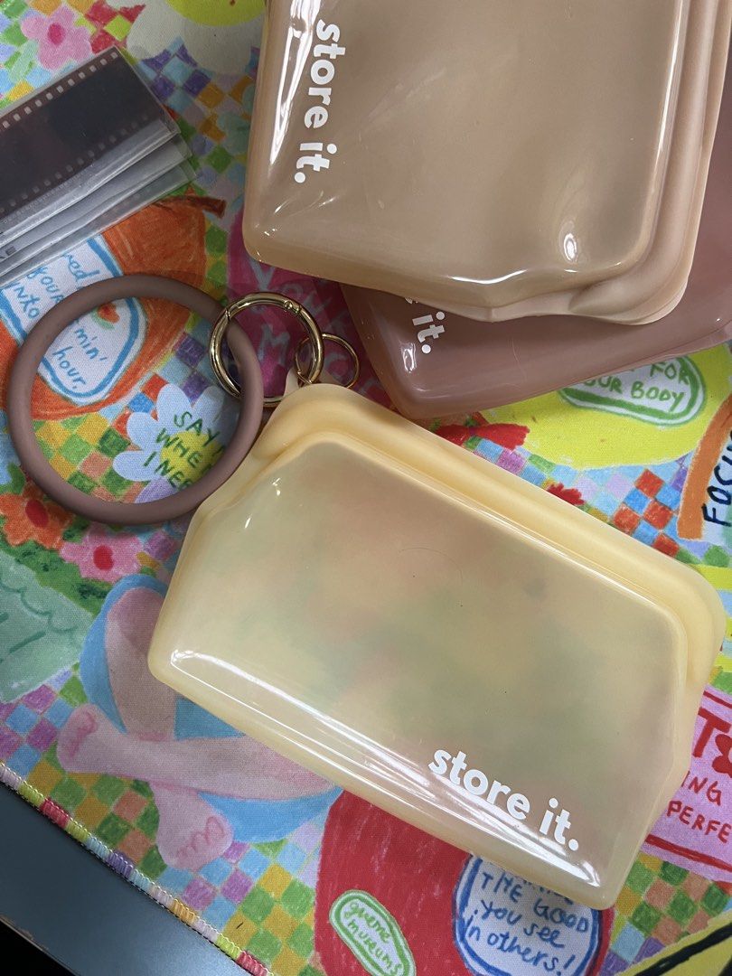 Store It Reusable Silicone Storage Bags Set (Category: Food Organization & Storage) located in Paranaque City. Submitted by guevssss (Listing ID 1463827651, Image 2). Description: Used, but good condition. - Set of 3 reusable silicone storage bags - Colors: Light yellow, beige, dusty rose - Features zip closure for secure sealing - Includes a convenient ring for carrying or hanging - Ideal for storing snacks, organizing travel essentials, or keep