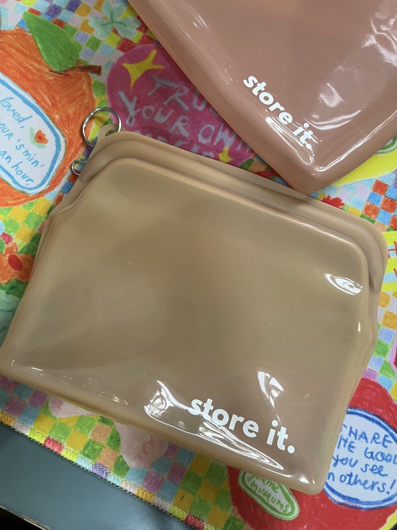 Store It Reusable Silicone Storage Bags Set (Category: Food Organization & Storage) located in Paranaque City. Submitted by guevssss (Listing ID 1463827651, Image 3). Description: Used, but good condition. - Set of 3 reusable silicone storage bags - Colors: Light yellow, beige, dusty rose - Features zip closure for secure sealing - Includes a convenient ring for carrying or hanging - Ideal for storing snacks, organizing travel essentials, or keep
