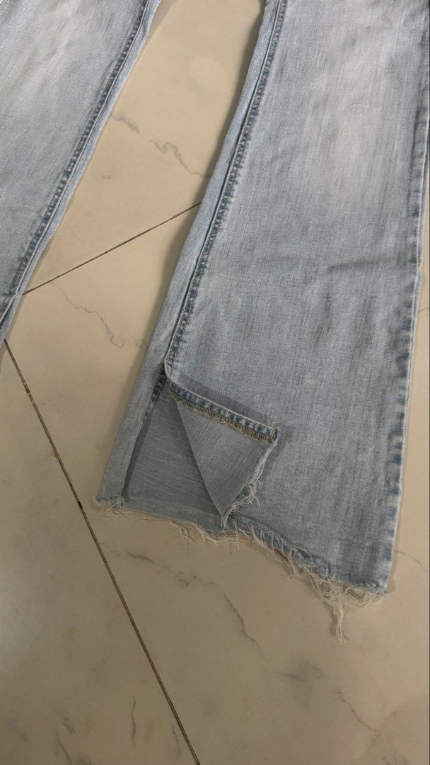 Stradivarius Light Wash Flared Jeans with Raw Hem (Category: Jeans) located in Manila. Submitted by patc20 (Listing ID 1463815025, Image 2). Description: - Stradivarius Light Wash Flared Jeans - Size: 42 EU - Stretchy Denim - Unique raw hem detail - Slight slit at the ankle - Measurements: Waist approx. 15 inches, Inseam approx. 31 inches.