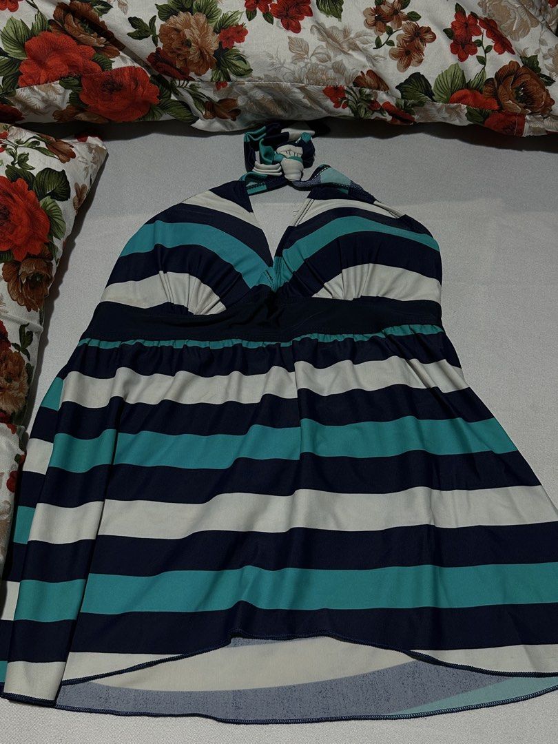 Striped Halterneck Swimsuit Top (Category: Bikinis & Swimsuits) located in Manila. Submitted by erikaerika05 (Listing ID 1463892083, Image 1). Description: PRE-LOVED SWIMWEAR COVER-UP SKIRT - Striped halterneck swimsuit top - Features navy, white, and teal stripes - Ties at the neck - Elasticated band under the bust for support Lightly used — worn only once 🫧 May have minimal washable stains from use/storage 📸 Photo note: Actual color may sligh