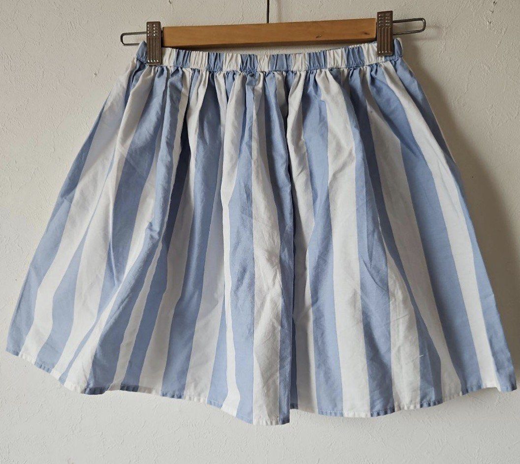 Striped Waist Skirt (Category: Skirts) located in Manila. Submitted by itsarah (Listing ID 1463852181, Image 1). Description: - Cute blue and white striped design - Comfortable elastic waistband - Lightweight and breezy fabric - Ideal for casual outings or beach days - Versatile: pairs well with simple tops and sandals or sneakers.