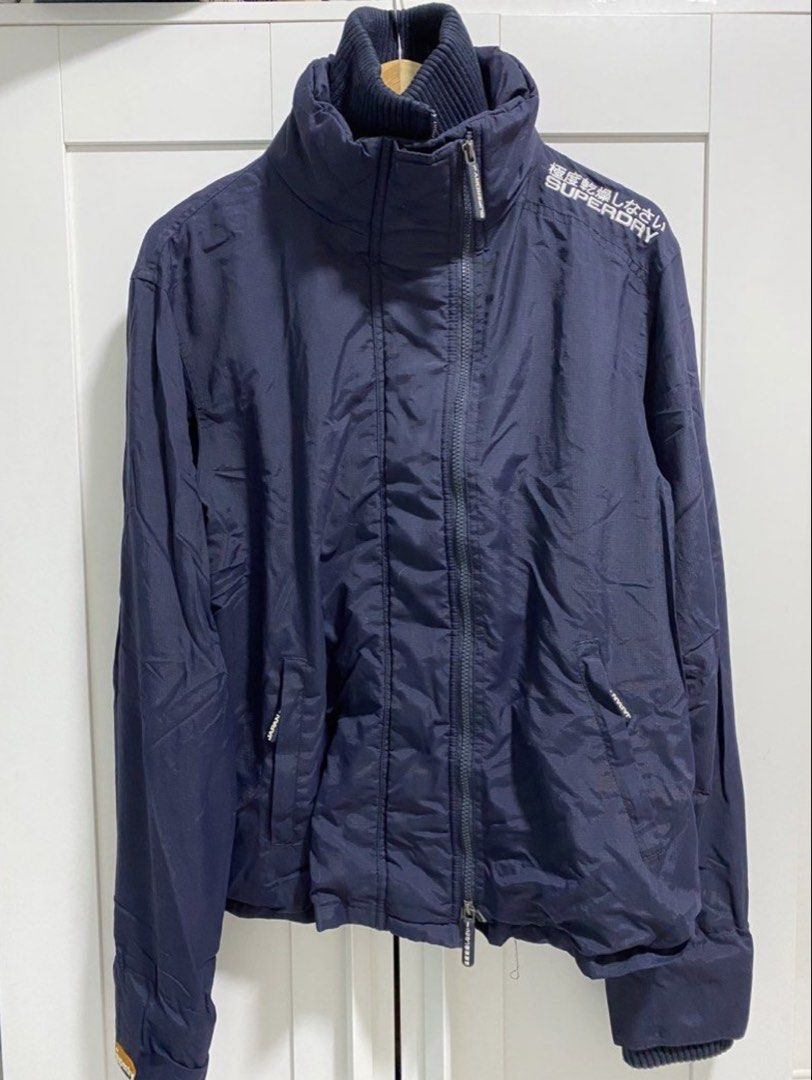 SUPERDRY Navy Windbreaker (Category: Coats, Jackets and Outerwear) located in Quezon City. Submitted by wearhouze (Listing ID 1463800650, Image 1). Description: Used once in Like New condition Good as new Complete zipper puller No issues.