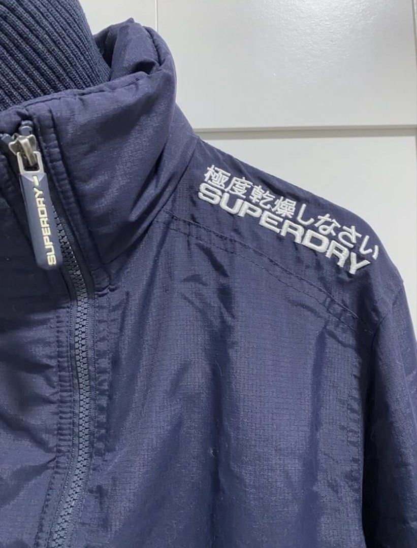SUPERDRY Navy Windbreaker (Category: Coats, Jackets and Outerwear) located in Quezon City. Submitted by wearhouze (Listing ID 1463800650, Image 2). Description: Used once in Like New condition Good as new Complete zipper puller No issues.