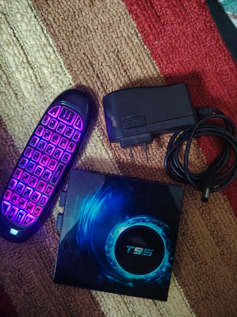 T95 TV Box with Remote and Power Adapter (Category: TV Parts & Accessories) located in Quezon City. Submitted by gentlejay03 (Listing ID 1463745405, Image 2). Description: - T95 TV Box - Includes remote with keyboard and power adapter - Remote features backlit keys for easy use - Ideal for streaming movies, shows, and using apps - Tested and confirmed working - Ready for its new owner.