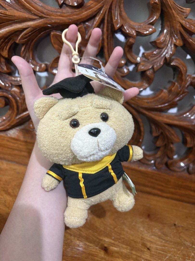 Ted 2 Graduation Bear Plush Toy Keychain (Category: Plushies & Soft Toys) located in Quezon City. Submitted by rxyel (Listing ID 1463803708, Image 3). Description: - Adorable Ted 2 plush toy - Dressed in a graduation gown and cap - Features a convenient keychain attachment - Brand new with original tag still attached - Ideal gift for Ted enthusiasts or as a graduation present.