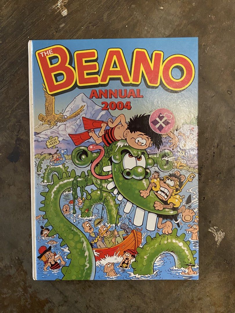 The Beano Annual 2004 Comic Book (Category: Comics & Manga) located in Manila. Submitted by bookcartelhub (Listing ID 1463935330, Image 1). Description: - Beano Annual 2004 Edition - Features beloved characters Dennis the Menace and Gnasher - Packed with hilarious comic strips - Includes engaging activities - Perfect for fans of classic British comics - Enjoyable for both kids and adults - A fantastic collectible item.