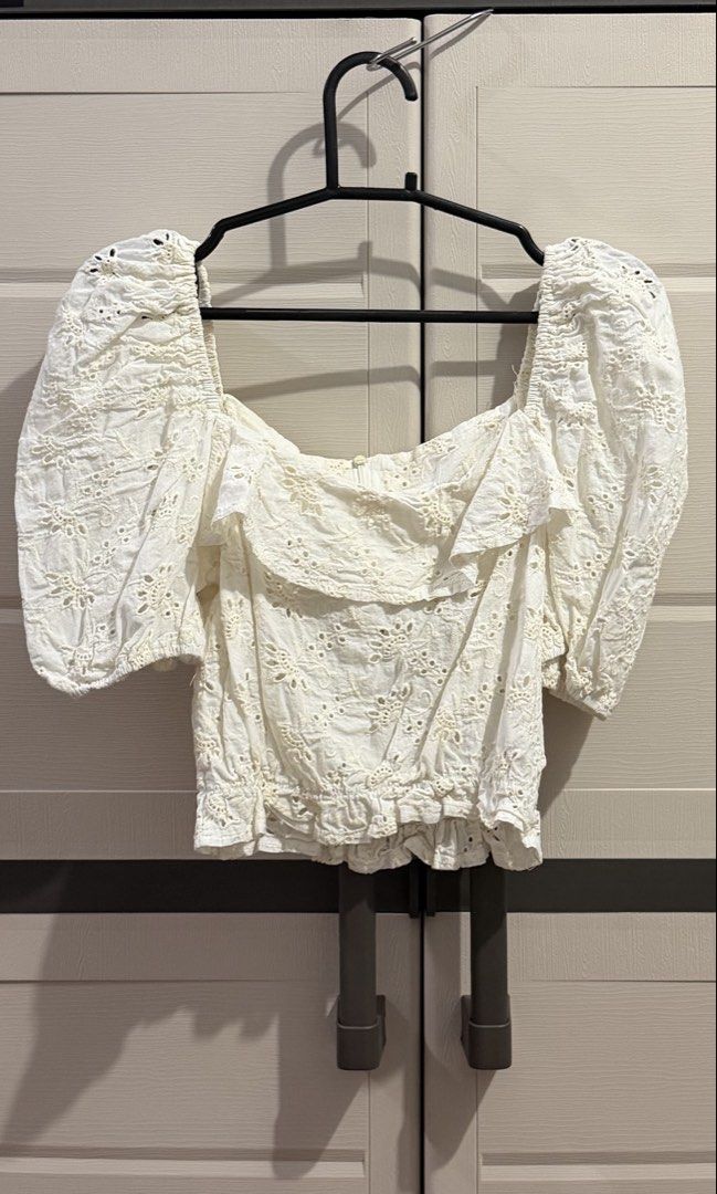 The Unit Made White Eyelet Puff Sleeve Top (Category: Blouses) located in Imus. Submitted by ann.declutters22 (Listing ID 1463751469, Image 1). Description: - White puff sleeve top from The Unit - Made in Korea - All-over eyelet detailing - Ruffled neckline - Elasticated hem - Super cute and summery vibe - Versatile for dressing up or down.