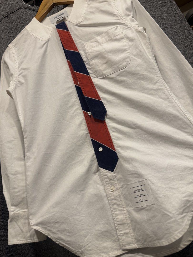 Thom Browne (Category: Longsleeves) located in Quezon City. Submitted by macleen17 (Listing ID 1463832963, Image 2). Description: Thom browne Size 40 Excellent Condition White color Necktie design iconic Color of thom browne Made in italy.