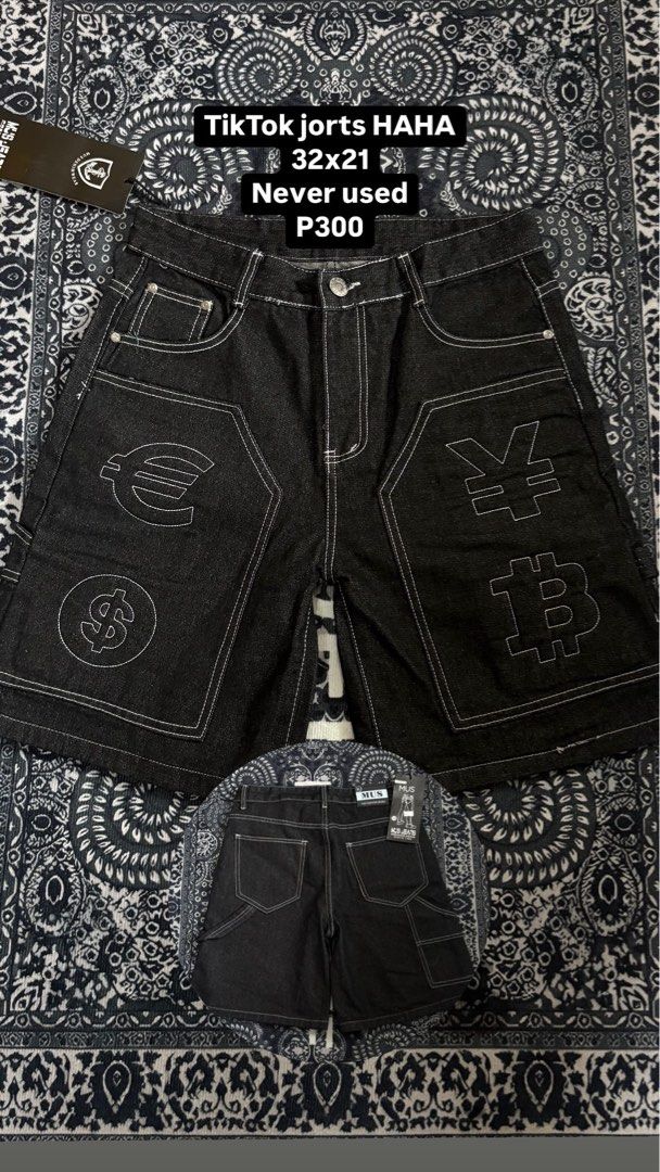 TikTok jorts HAHA 32x21 (Category: Shorts) located in Makati City. Submitted by sseurekiii (Listing ID 1463755105, Image 1). Description: - Never used black denim shorts with tags still attached. - Size: 32x21 - Features unique white stitching. - Embroidered with various currency symbols: Euro, Yen, Dollar, and Bitcoin. - Ideal for creating a standout, statement look..