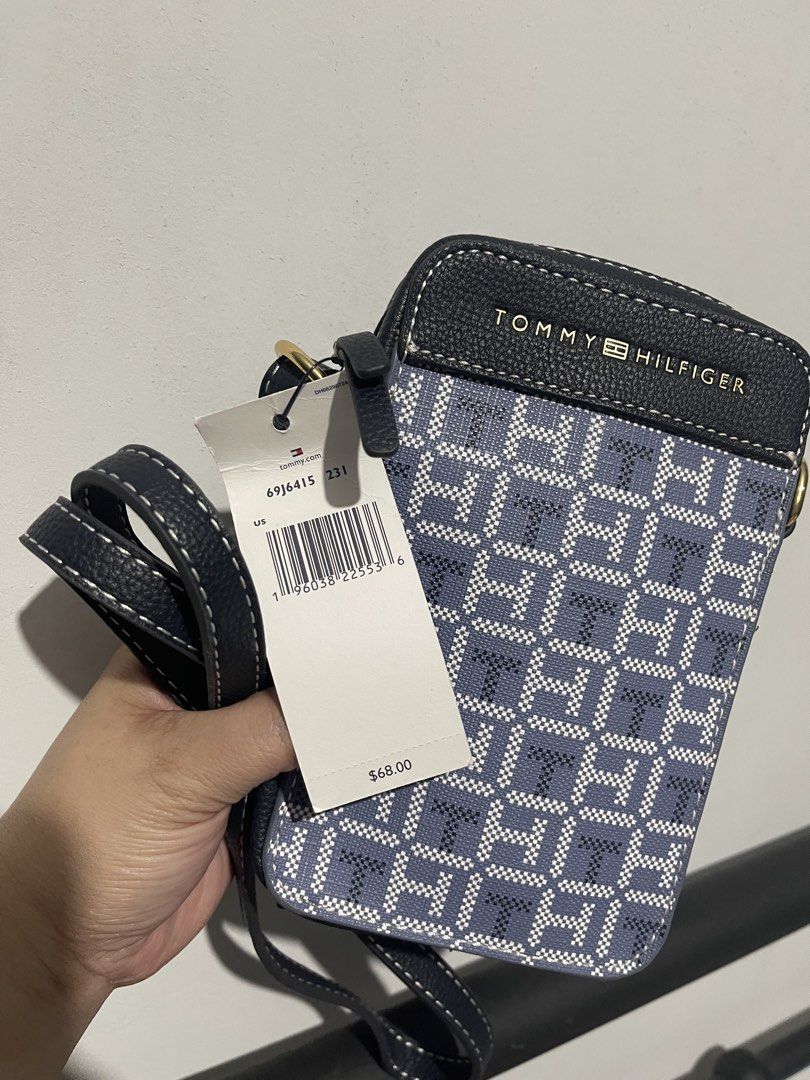 Tommy Hilfiger Monogram Phone Pouch Bag (Category: Cross-body Bags) located in Iloilo. Submitted by myjanna (Listing ID 1463862057, Image 3). Description: - Authentic Tommy Hilfiger phone pouch - Classic blue and white TH monogram pattern - Black trim and adjustable strap - Secure zipper closure - Comes with original tags attached - Perfect for keeping your phone and essentials accessible ✅sf c/o buyer ✅payment first 📍Iloilo City ❌COD ❌COP ❌chec