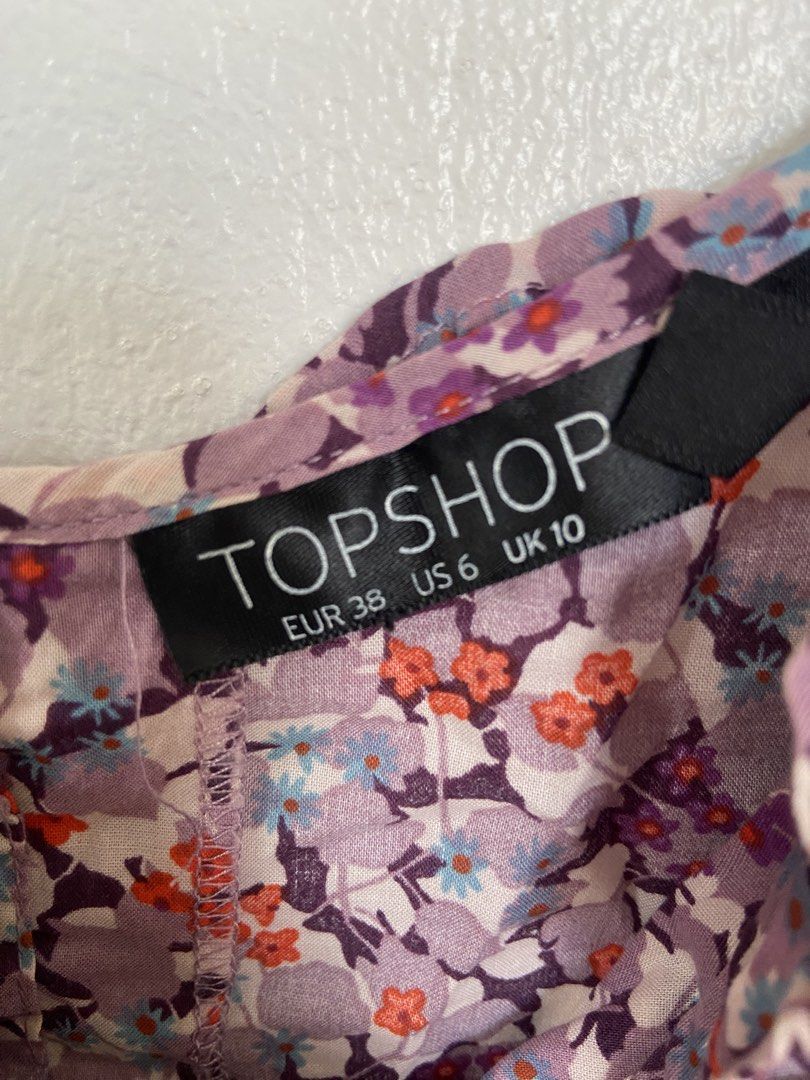 Topshop Floral Spaghetti Straps (Category: Dresses) located in Bacoor. Submitted by maybellescloset (Listing ID 1463757634, Image 2). Description: Bought in Dubai UAE RFS: decluttering No issues like new fits medium to semi large Payment: bpi or gcash Shipment: jnt - Cute floral print mini dress from Topshop - Features spaghetti straps - Tie detail at the waist - Lovely mix of purple, pink, and orange flowers - Ideal for casual outings or summer 