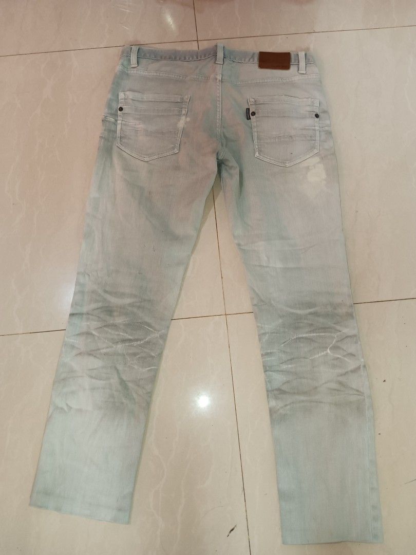 TORNADO MART Light Wash Distressed Denim Jeans (Category: Jeans) located in Jolo. Submitted by zah-zah (Listing ID 1463908594, Image 2). Description: -TORNADO MART Light wash denim jeans - Straight leg cut - Distressed and faded details on legs - Button fly closure - Two back pockets with stitching - Comfortable for everyday wear.
