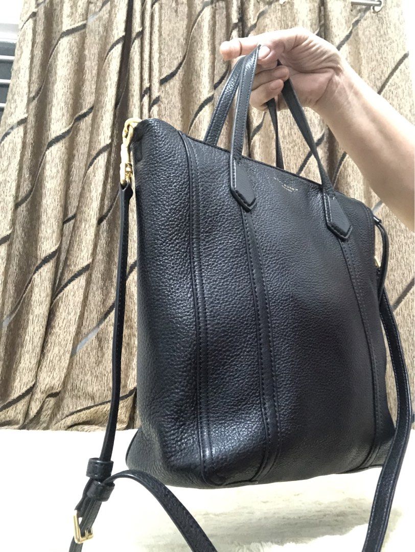 Tory Burch Black Leather Tote Bag with Shoulder Strap (Category: Tote Bags) located in Rizal. Submitted by elviedc2420209 (Listing ID 1463880085, Image 3). Description: - Brand: Tory Burch - Material: Black pebbled leather - Style: Tote bag - Features: Top handles, detachable shoulder strap - Interior: Zip pocket, slip pocket - Hardware: Gold - Size: Spacious for daily essentials.