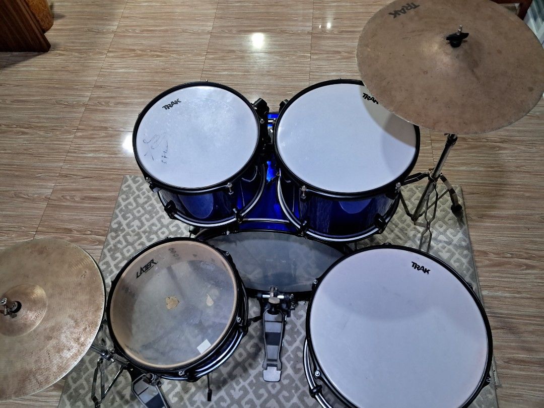 TRAK Drum Set with Cymbals and Pedals (Category: Musical Instruments) located in Manila. Submitted by wildfalcon_b4744f (Listing ID 1463775979, Image 2). Description: - Full drum set for sale - Includes bass drum, toms, snare, cymbals, and pedals - Attractive blue finish on drums - Ready for practice or performance - Minor cosmetic wear on cymbals and pedals from normal use - Perfect for drummers of all levels - Slighlty Negotiable.
