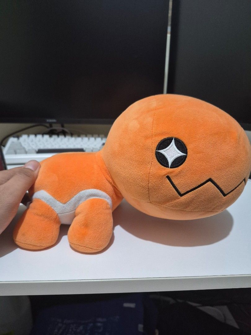 Trapinch Banpresto Pokemon Plushie (Category: Plushies & Soft Toys) located in Binangonan. Submitted by oyiebhoy (Listing ID 1463789021, Image 1). Description: - Adorable orange plush toy - Unique black zig-zag line on head - Cute star-shaped eye - White stripe on belly - Super soft and cuddly - Ideal gift for Pokemon enthusiasts.