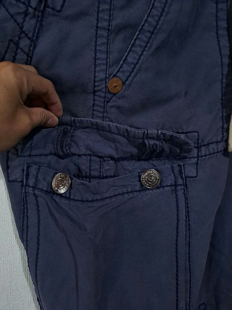 🔥True Religion Multi-Pocket Utility Cargo Pants🔥 (Category: Trousers) located in Quezon City. Submitted by yaseen73 (Listing ID 1463807793, Image 3). Description: True Religion Multi - Pocket Utility Cargo Pants Blue With A Drawstring Waist True Religion Logo and Adjustable Leg Opening Wearing Size : 30 on Tag Actual Waistline : 33/34 Front Rise 11 Front Thigh 12 Leg Opening 9 Length 43 - Needs Wash - Color Rate : 9.2/10 - With Minimal Sun Fade