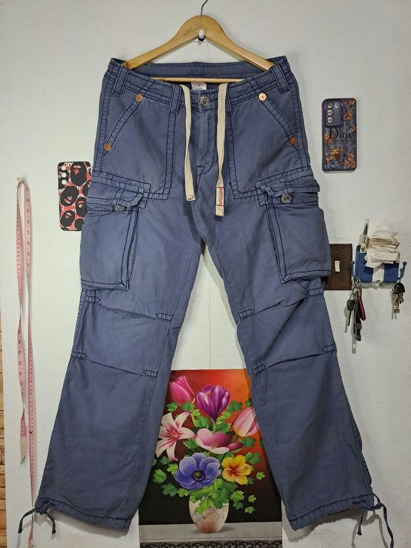 🔥True Religion Multi-Pocket Utility Cargo Pants🔥 (Category: Trousers) located in Quezon City. Submitted by yaseen73 (Listing ID 1463807793, Image 1). Description: True Religion Multi - Pocket Utility Cargo Pants Blue With A Drawstring Waist True Religion Logo and Adjustable Leg Opening Wearing Size : 30 on Tag Actual Waistline : 33/34 Front Rise 11 Front Thigh 12 Leg Opening 9 Length 43 - Needs Wash - Color Rate : 9.2/10 - With Minimal Sun Fade