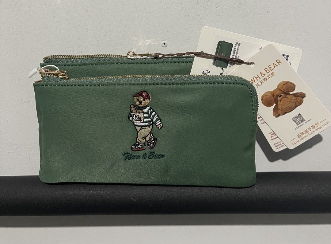 TTWN Bear Pouch (Category: Purses & Pouches) located in Iloilo. Submitted by myjanna (Listing ID 1463864060, Image 1). Description: - Cute green pouch set with embroidered bear design. - Features two zippered compartments for organization. - Includes card slots inside. - Stylish gold zipper details. - Perfect for keeping small essentials tidy. - Brand new with tags attached. -Bought in Thailand -Comes with its own dust bag ✅sf c/o buyer ✅payment 