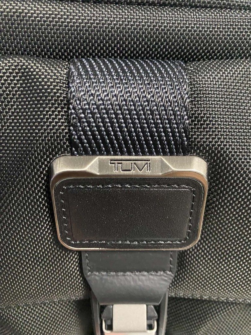 Tumi Black Nylon Crossbody Bag (Category: Sling Bags) located in San Juan City. Submitted by iam_phoenix (Listing ID 1463862699, Image 2). Description: Tumi Alpha Bravo Junior Crossbody Color: Black Dimensions: 7cm × 22cm × 24cm In almost brand new condition Interior: 2 card pockets Media open pocket Zip pocket Key leash Tumi tracer Pen holders Exterior: L-zip entry to main compartment L-zip front pocket Back slip pocket Adjustable shoulder strap