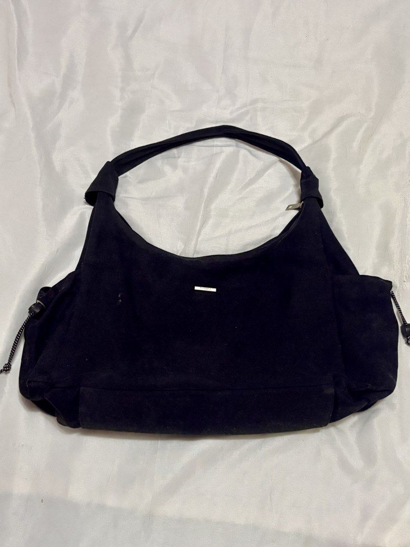 Tweely Black Shoulder Bag (Category: Shoulder Bags) located in Taguig. Submitted by thenemy (Listing ID 1463904512, Image 1). Description: - Brand: Tweely - Classic black hobo bag - Made of cotton-blend material - Can fit 13 inch laptop - With side compartments for umbrella and water bottle (can fit an Owala bottle) - Needs light cleaning from dust 📍Taguig City, near BGC - Delivery through Lalamove or Grab (fee shouldered by buyer) - Meet-ups at