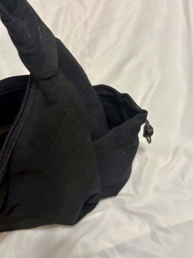 Tweely Black Shoulder Bag (Category: Shoulder Bags) located in Taguig. Submitted by thenemy (Listing ID 1463904512, Image 3). Description: - Brand: Tweely - Classic black hobo bag - Made of cotton-blend material - Can fit 13 inch laptop - With side compartments for umbrella and water bottle (can fit an Owala bottle) - Needs light cleaning from dust 📍Taguig City, near BGC - Delivery through Lalamove or Grab (fee shouldered by buyer) - Meet-ups at