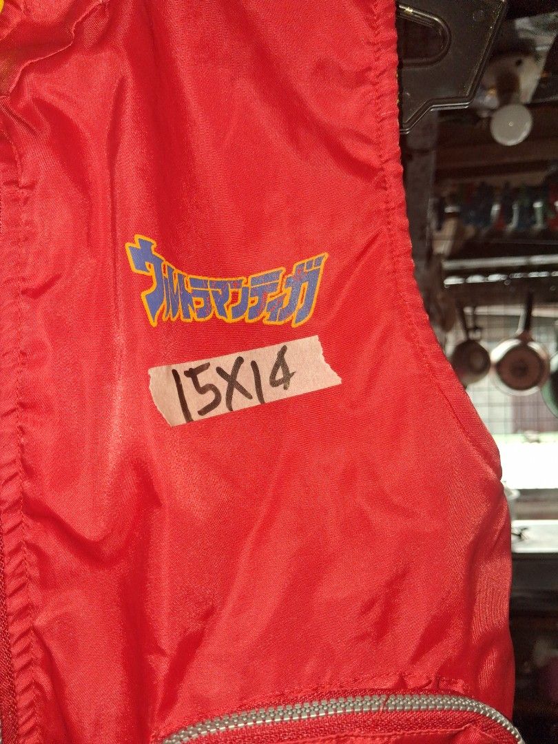 Ultraman Vest with Yellow Lining (Category: Vests) located in Manila. Submitted by marcas022798212 (Listing ID 1463753400, Image 3). Description: - Red vest with yellow lining - Two zippered front pockets - Brand logo on chest - Additional logo on side pocket - Size: 15x14 - Ideal for outdoor activities.
